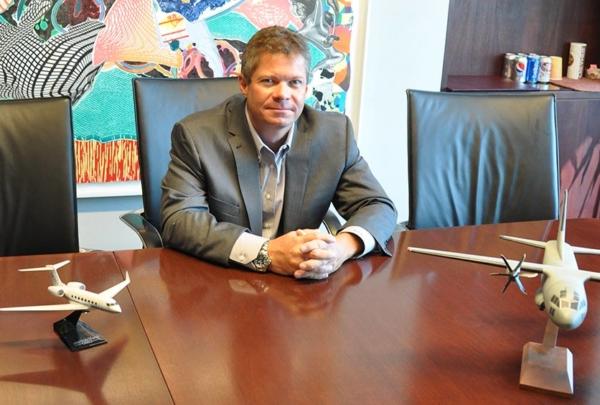 澳门足彩app's Paul Raudenbush sitting at a table.